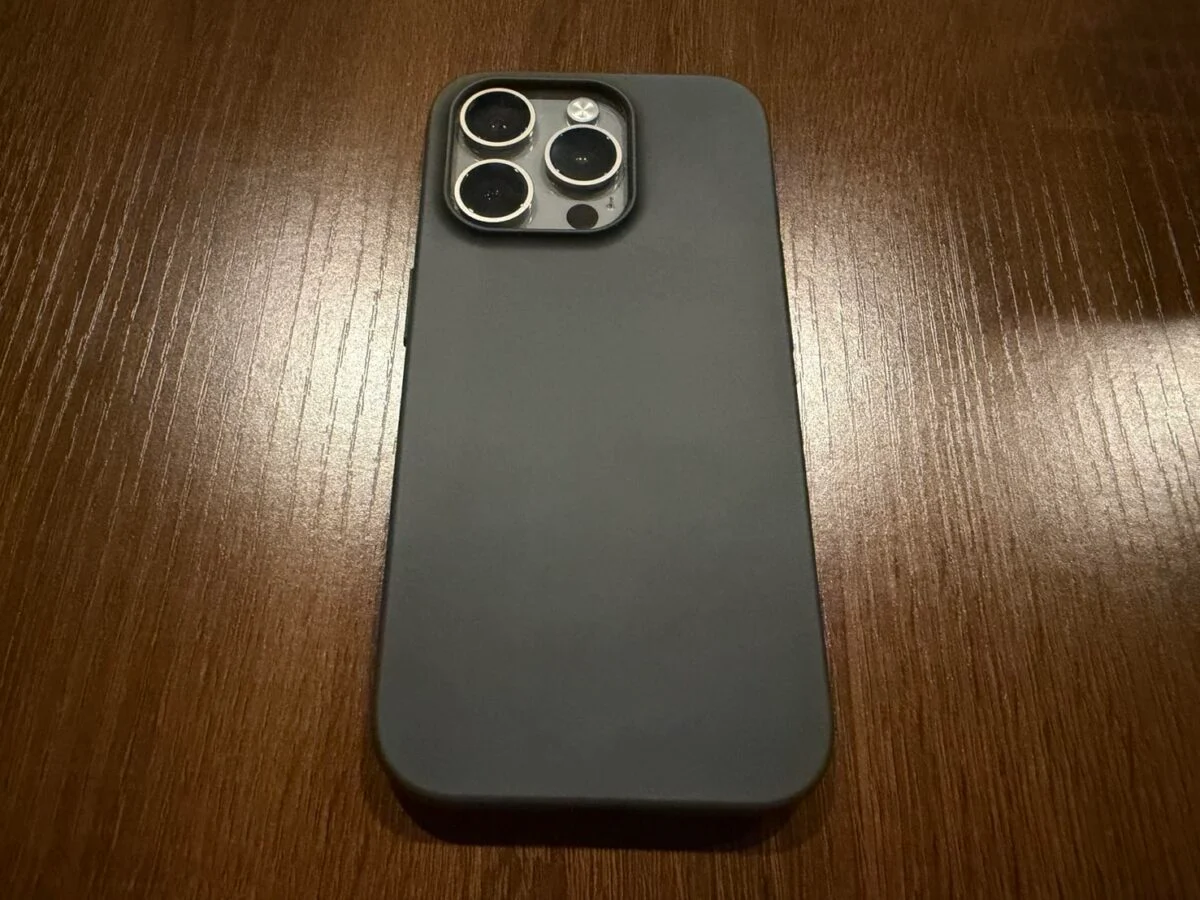 iPhone 15 Pro equipped with MUJI dark gray case