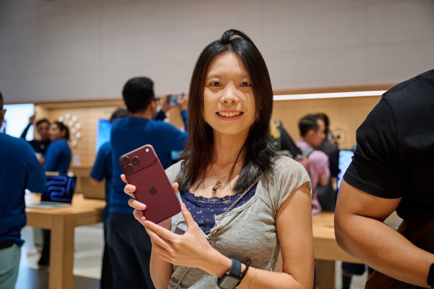 Customer holding an iPhone 18 Pro at Apple The Exchange TRX in Kuala Lumpur