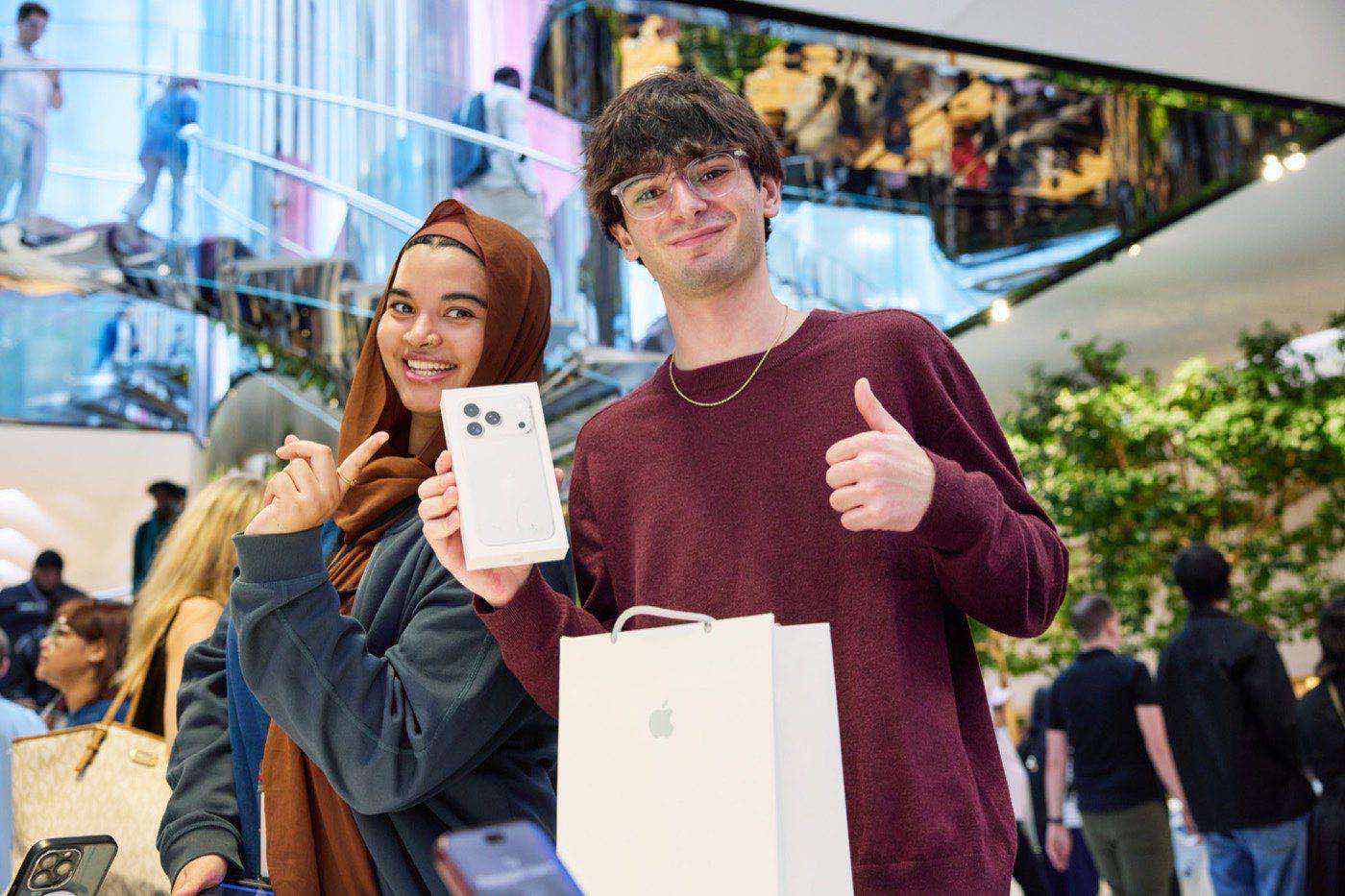 Customer holding a new iPhone 18 Pro purchase at Fifth Avenue