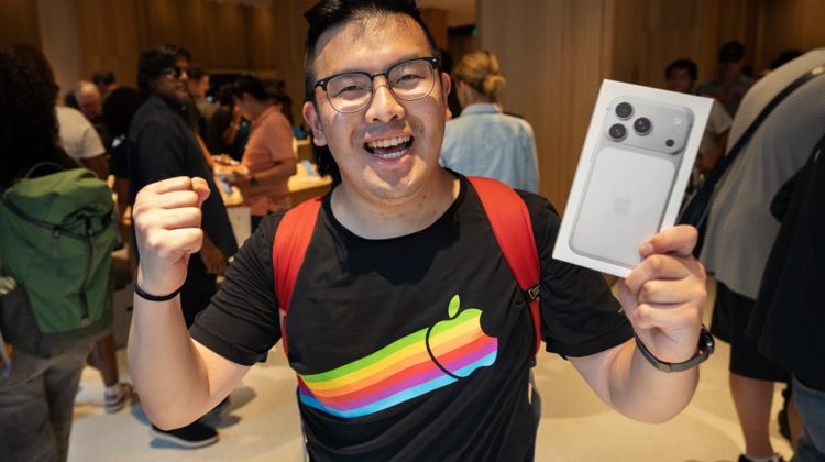 Customer holding silver iPhone 17 Pro at Apple Downtown Detroit from Apple Newsroom